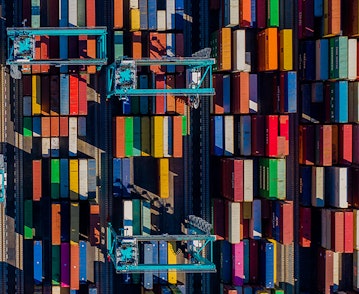 An aerial view of a loaded container ship